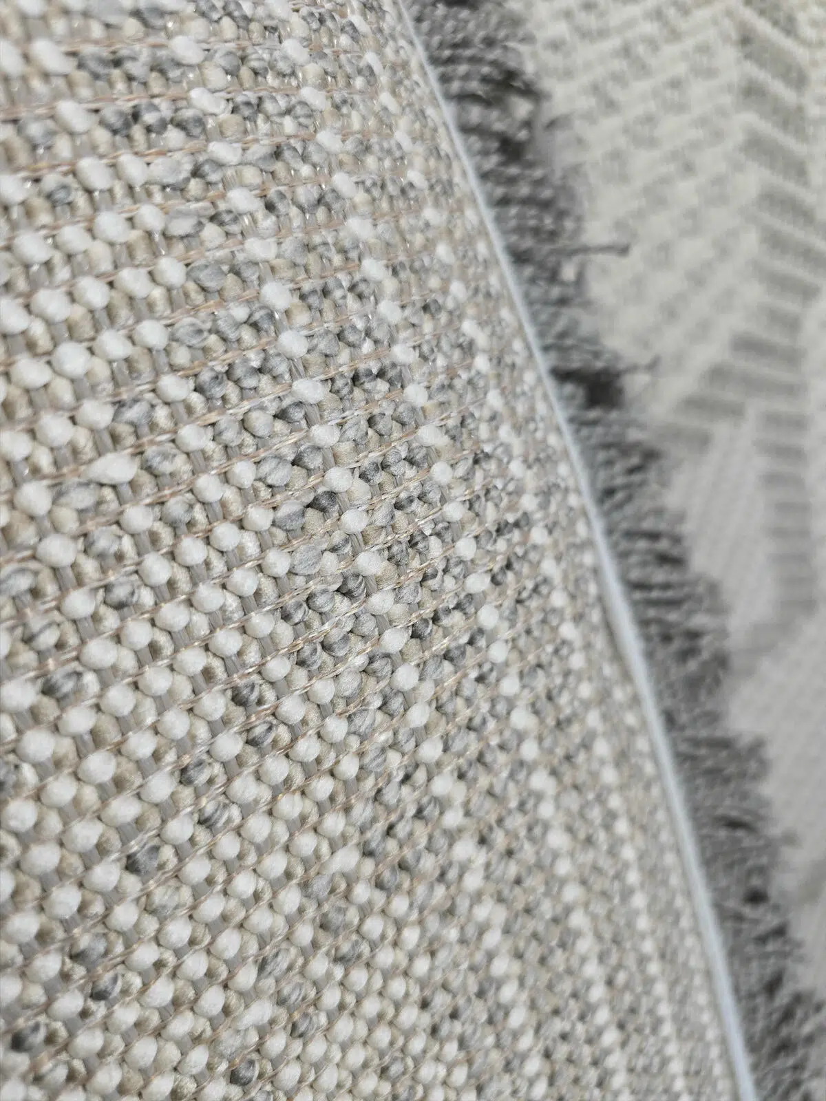 Close-up of Zephyr rug’s backing construction and base yarn texture