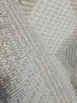 Back texture of Crater rug showing stitching and weave