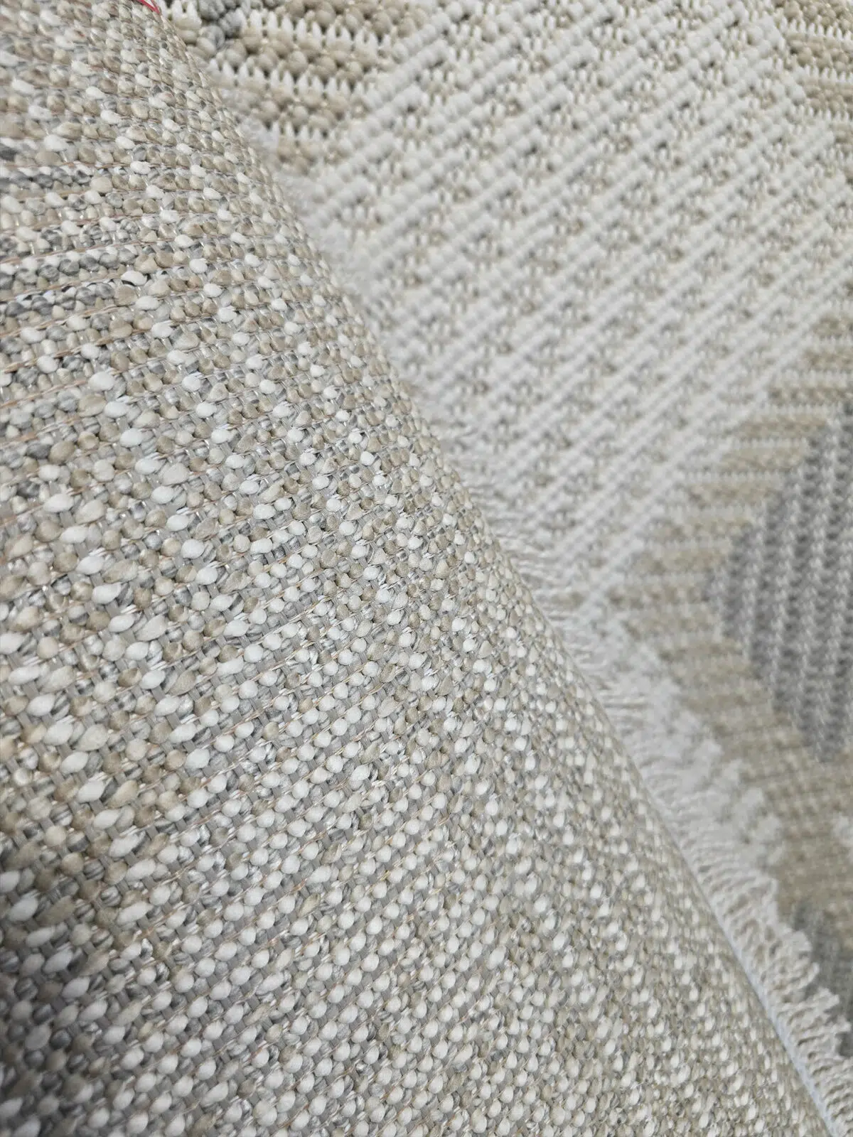 Back texture of Crater rug showing stitching and weave