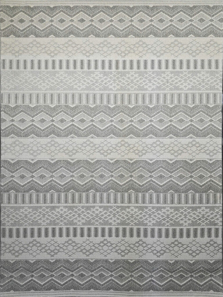 Detailed shot of Nebulon rug’s grey and cream diamonds