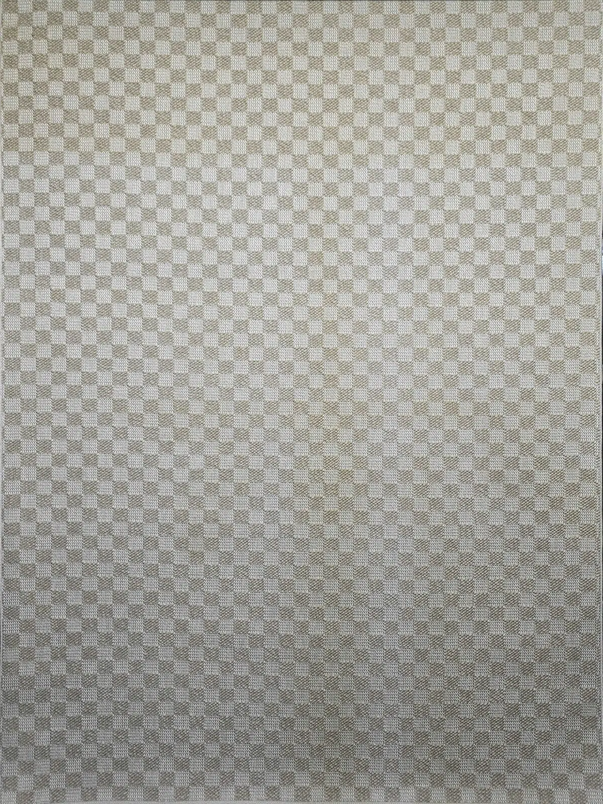 Overhead view showing the geometric texture of the Helios rug in beige