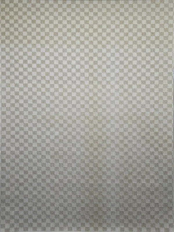 Overhead view showing the geometric texture of the Helios rug in beige