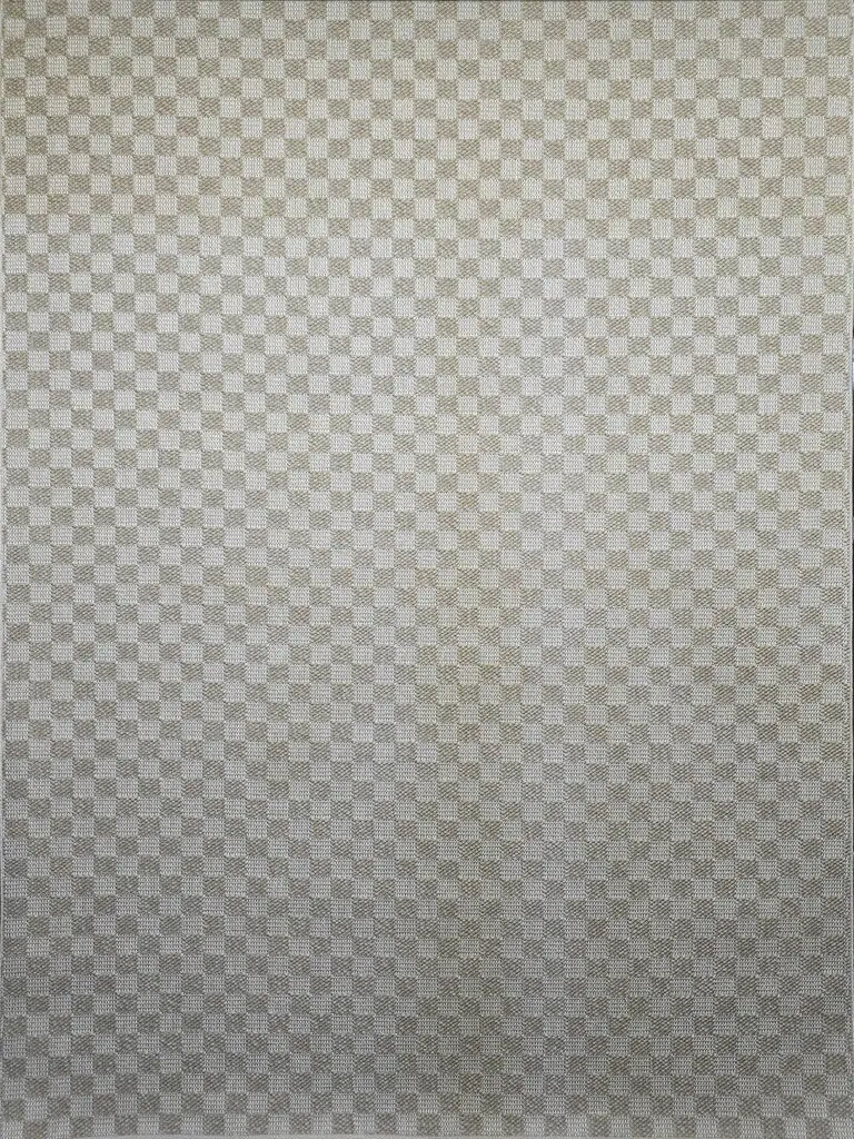 Overhead view showing the geometric texture of the Helios rug in beige