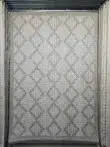 Full hanging view of Zephyr rug showcasing its diamond-shaped woven texture