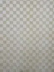 Closeup mid-area of the Helios rug highlighting check pattern and weave