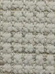 Detailed yarn structure of the Juno carpet in ivory and beige tones