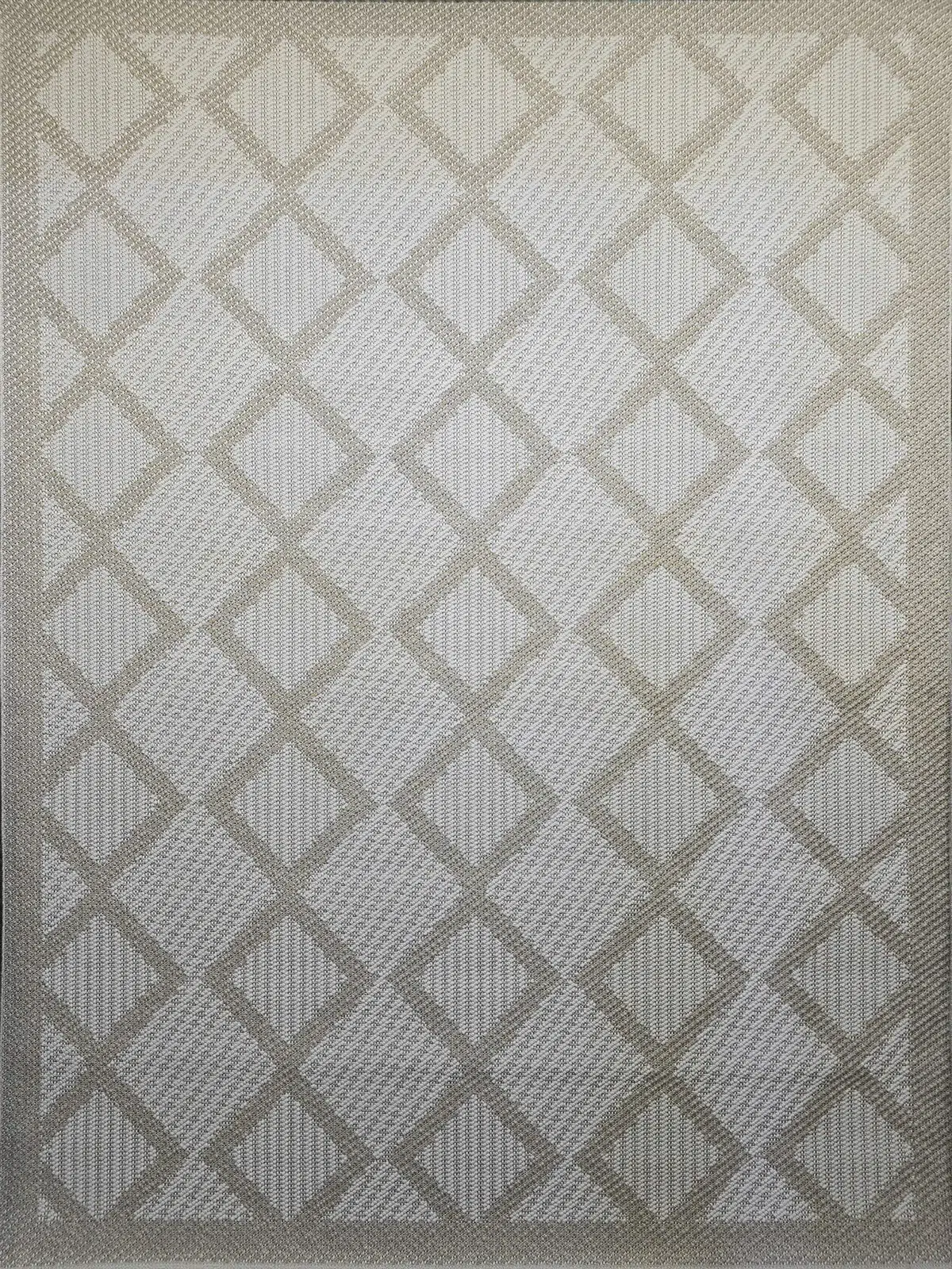 Flat image of the beige Nocturne rug with symmetrical diamond patterns