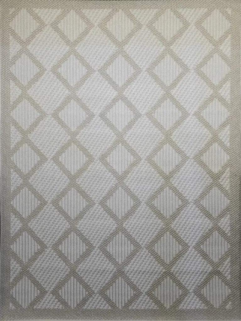 Flat image of the beige Nocturne rug with symmetrical diamond patterns