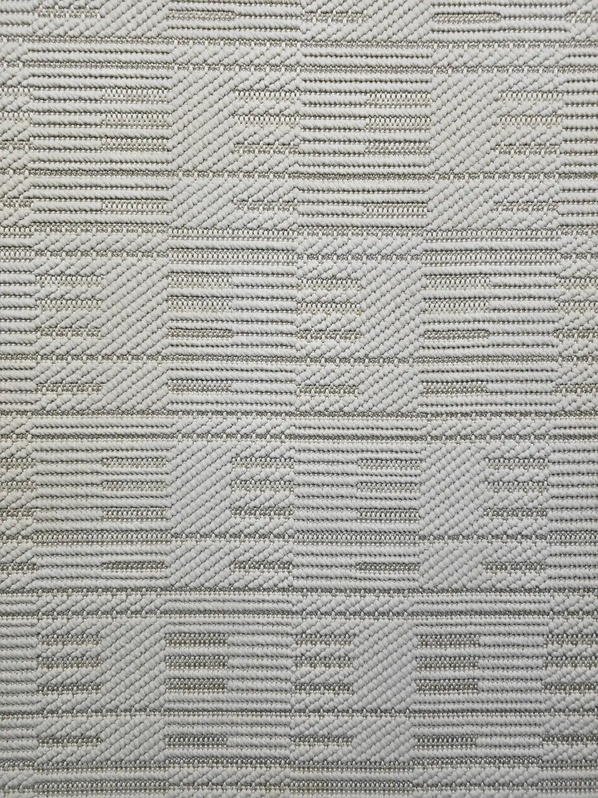 Mid-range zoom of Vortex rug showing small detailed geometric shapes