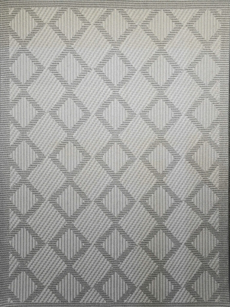 Complete flat layout of Zephyr rug with textured diamond grid design