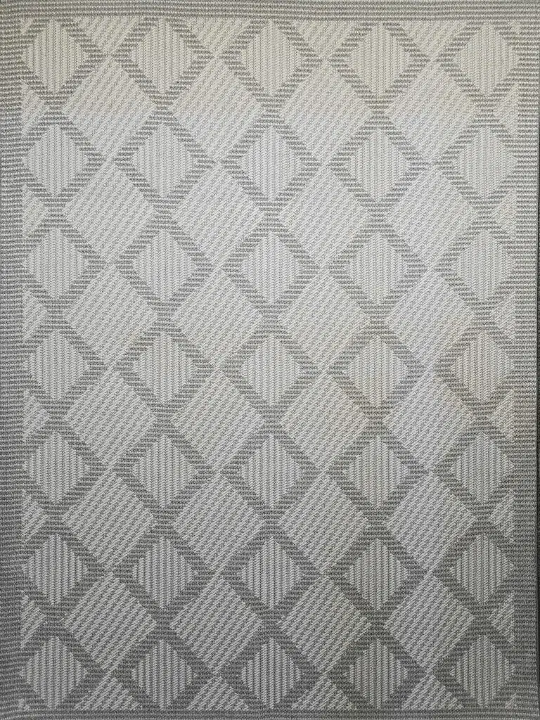 Complete flat layout of Zephyr rug with textured diamond grid design