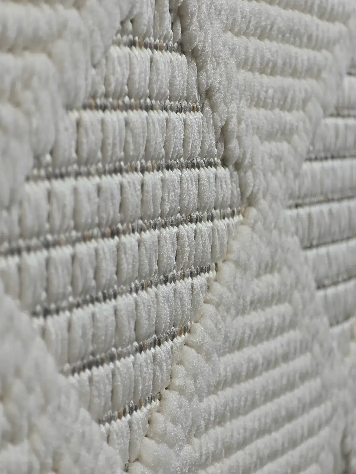 Mars rug close-up showing shimmering fiber details and elevated weave