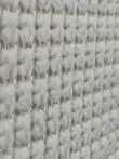 Orbit carpet close-up from the side showing soft vertical yarn lines