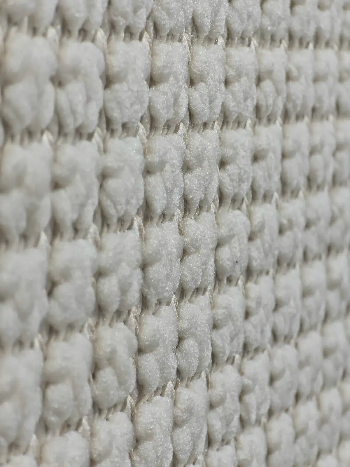 Orbit carpet close-up from the side showing soft vertical yarn lines