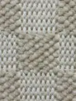 High-detail shot of the checker pattern and yarns on Helios rug