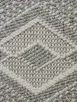 Close shot of cream yarn on Nebulon rug surface