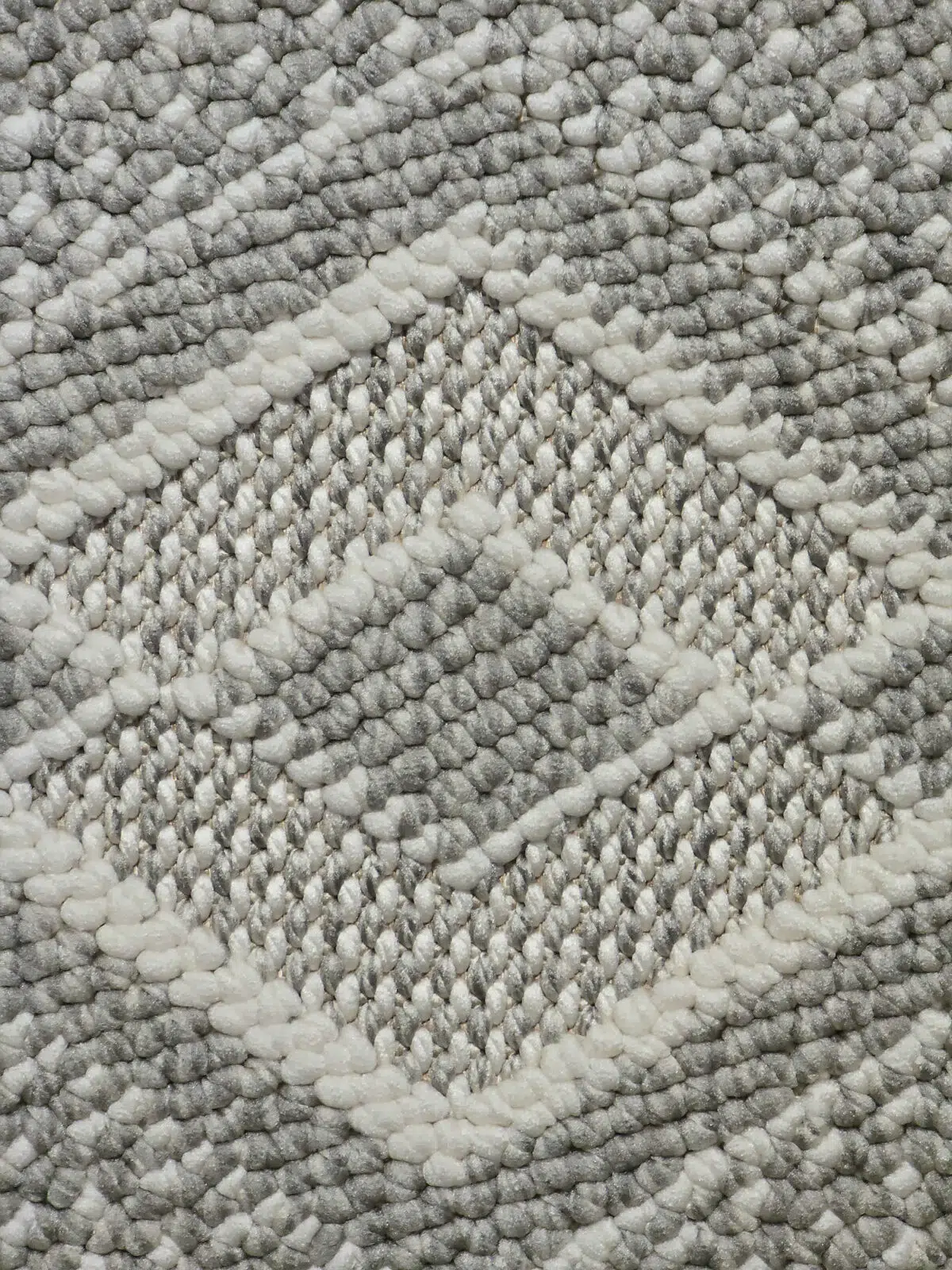 Close shot of cream yarn on Nebulon rug surface