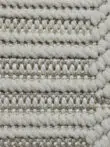Close-up macro shot showing thick soft yarn texture on the Vortex rug