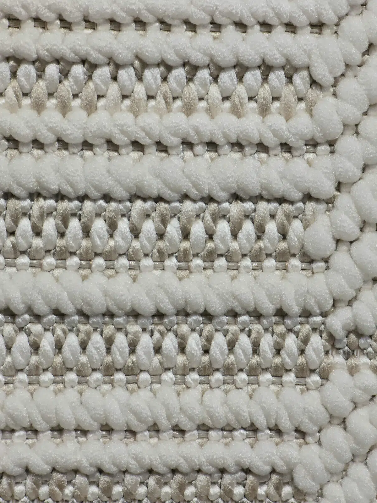 Close-up macro shot showing thick soft yarn texture on the Vortex rug