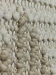 Side angle showing 3D woven texture of Comet rug