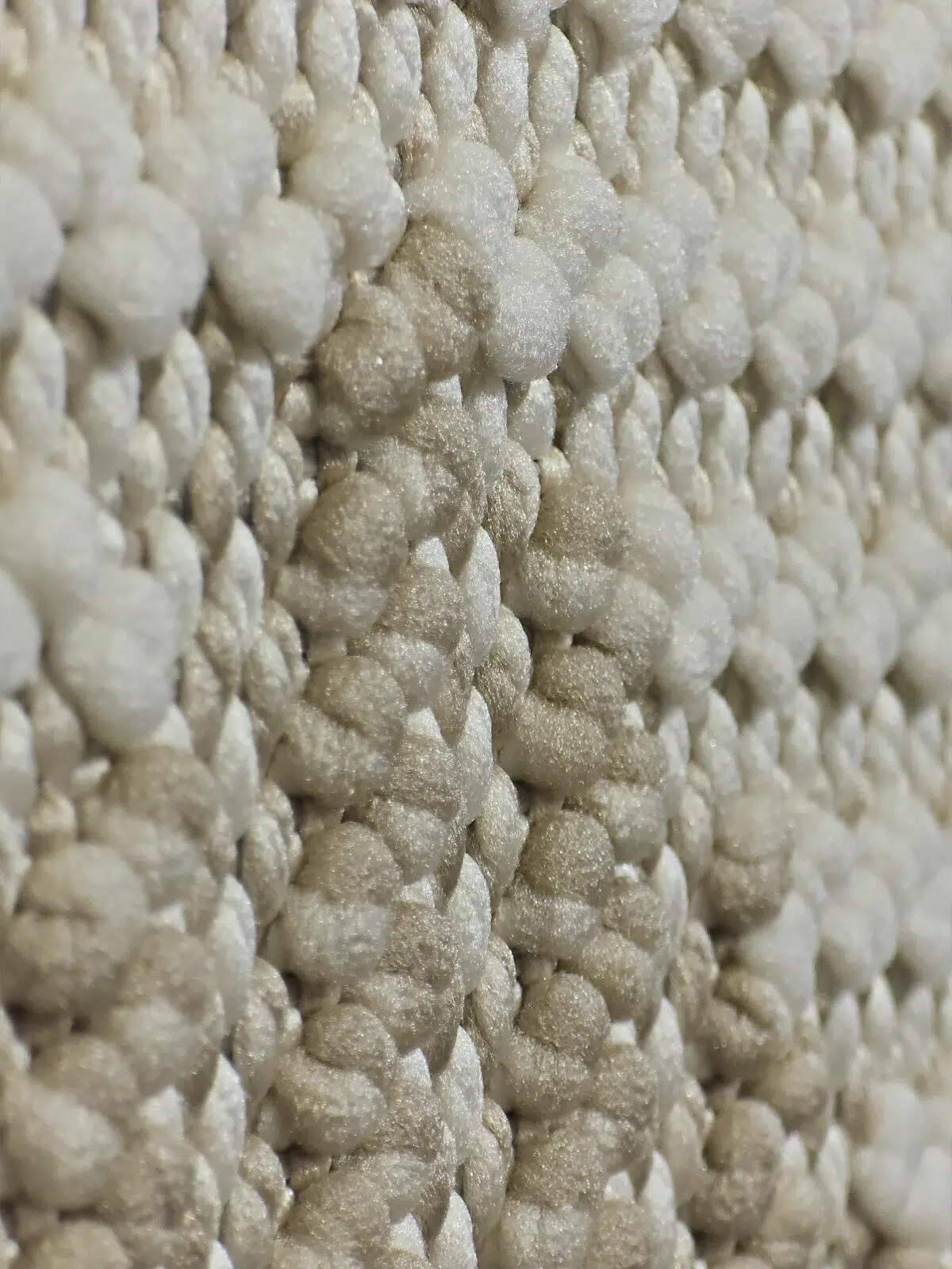 Side angle showing 3D woven texture of Comet rug