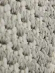 Yarn detail of Juno rug showing mix of white and grey fibers