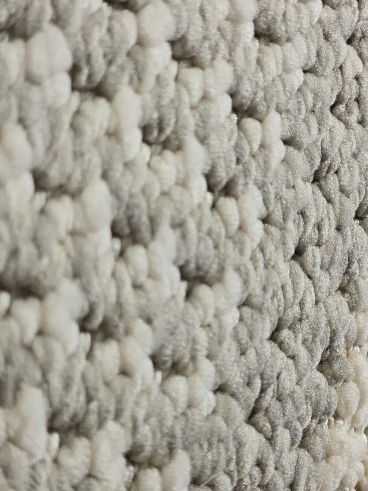 Yarn detail of Juno rug showing mix of white and grey fibers