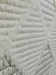 Side perspective of Mars rug with close-knit geometric design