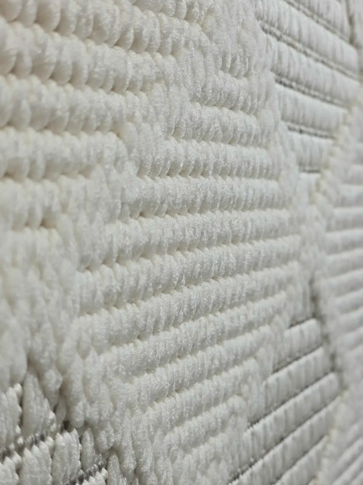 Side perspective of Mars rug with close-knit geometric design