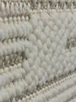 Side view of raised loop texture on the Vortex rug pattern