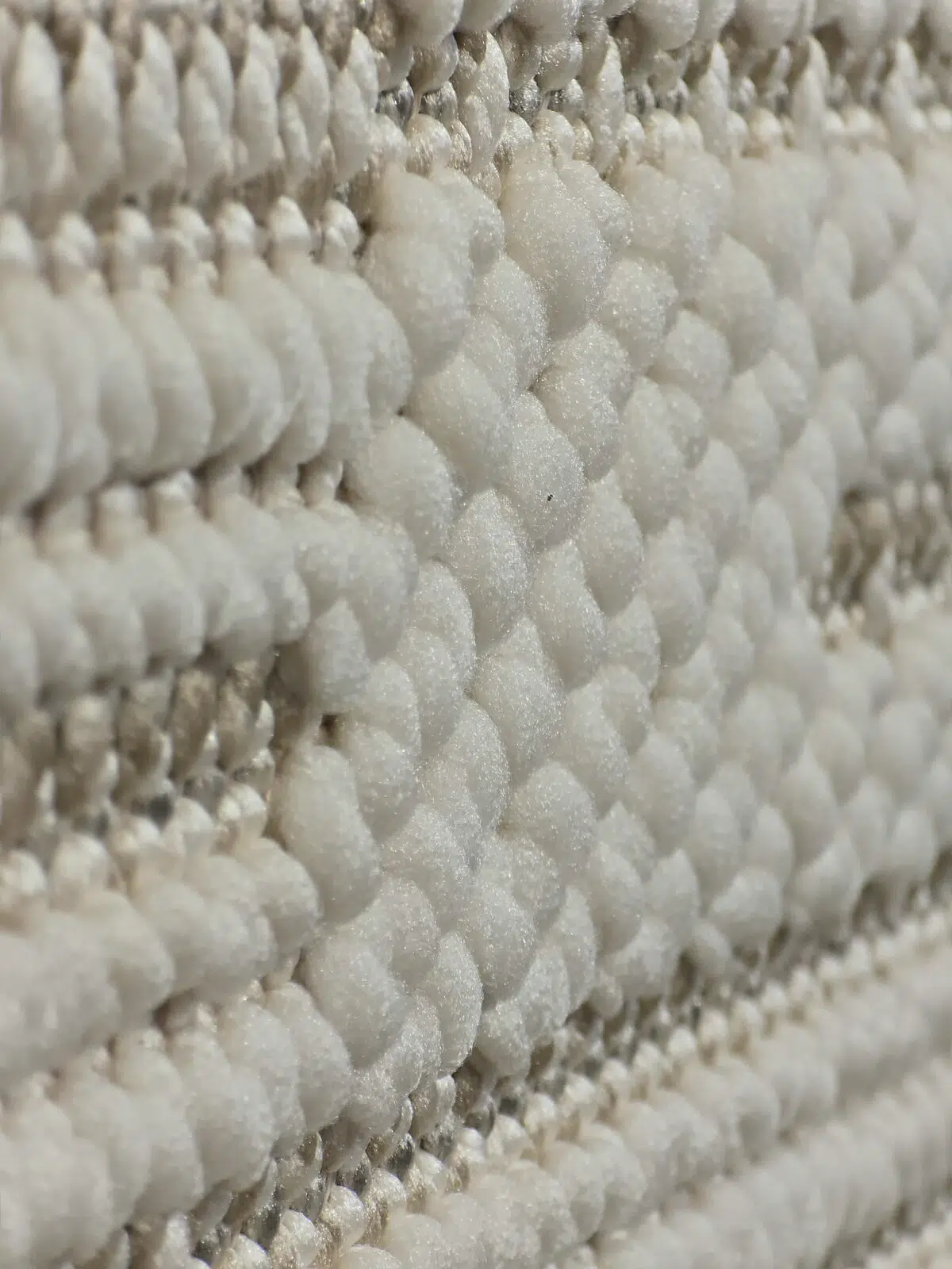 Side view of raised loop texture on the Vortex rug pattern