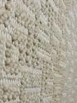 Macro image of the Oberon rug’s subtle beige texture