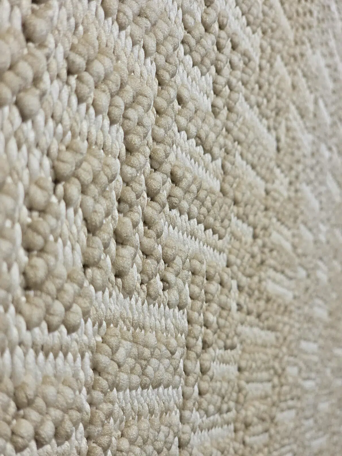 Macro image of the Oberon rug’s subtle beige texture