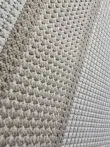 Diagonal texture of Orbit carpet showing looped yarn and detailed edge