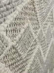 Side angle of rug showing the yarn’s 3D raised pattern