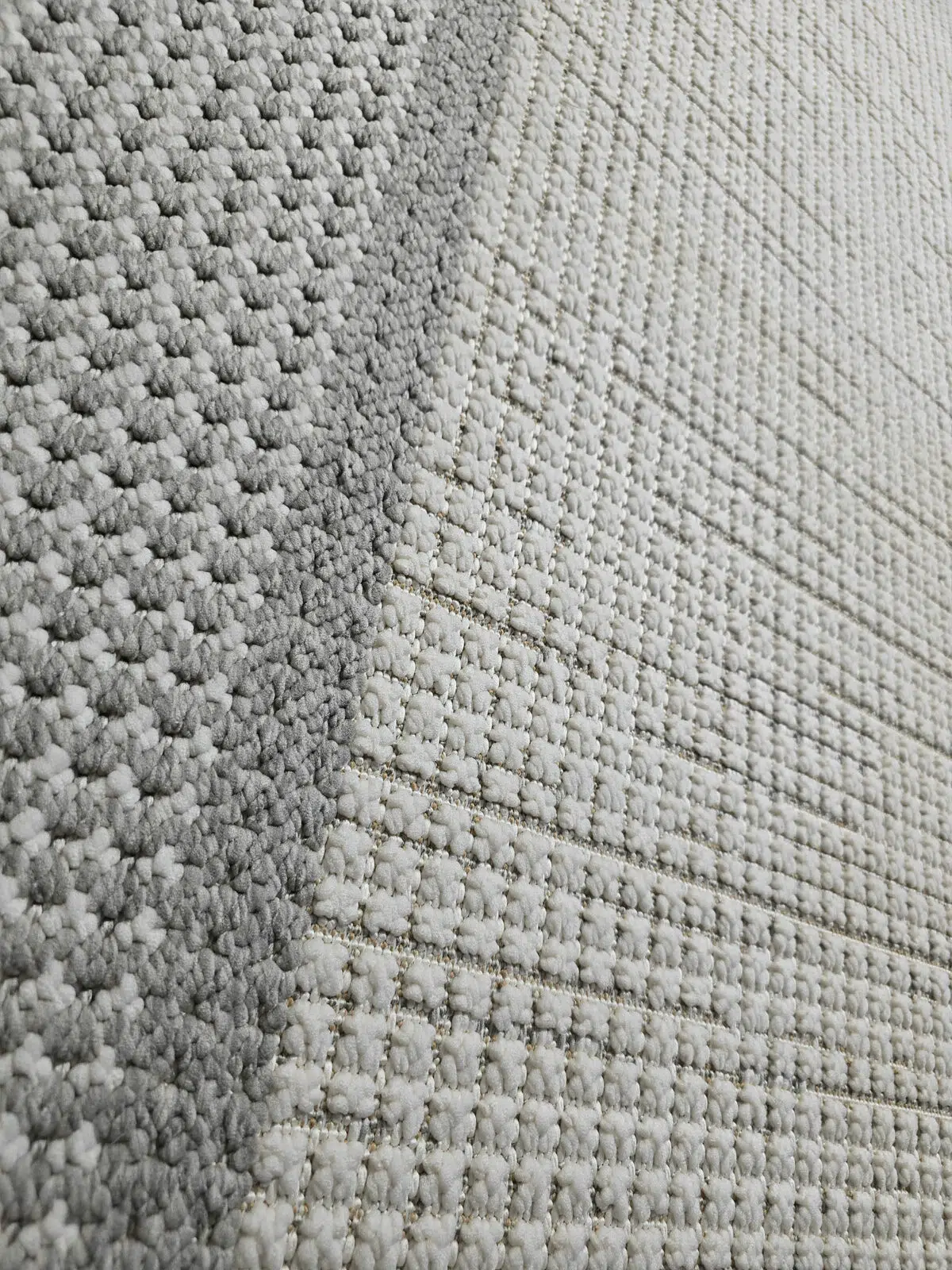 Angled shot of Juno carpet showing contrast between inner and outer border