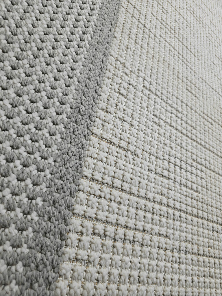 Angled shot of Juno carpet showing contrast between inner and outer border