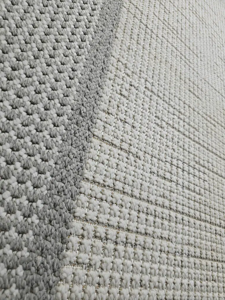 Angled shot of Juno carpet showing contrast between inner and outer border