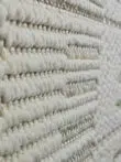 Angled image of the Vortex rug showing the linear arrangement of textures