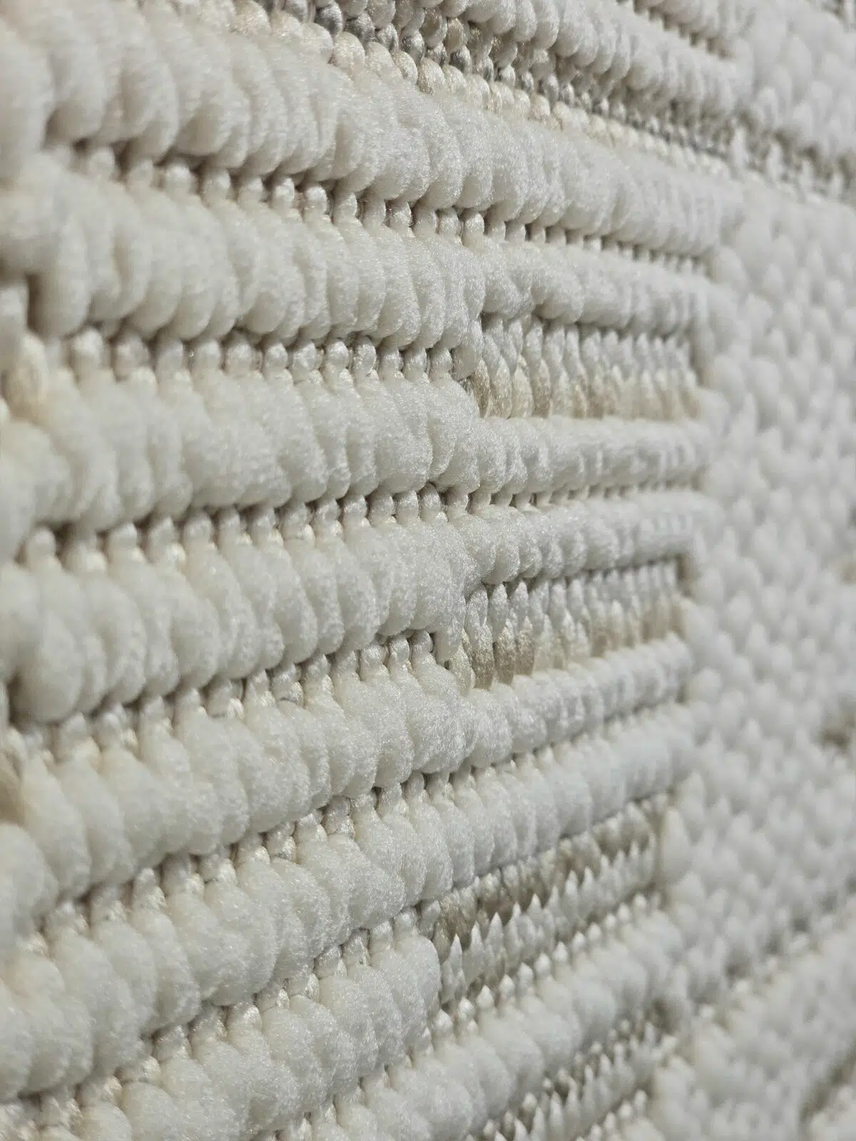 Angled image of the Vortex rug showing the linear arrangement of textures