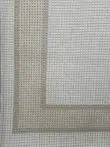 Orbit rug photo showing corner with double-line beige and white border