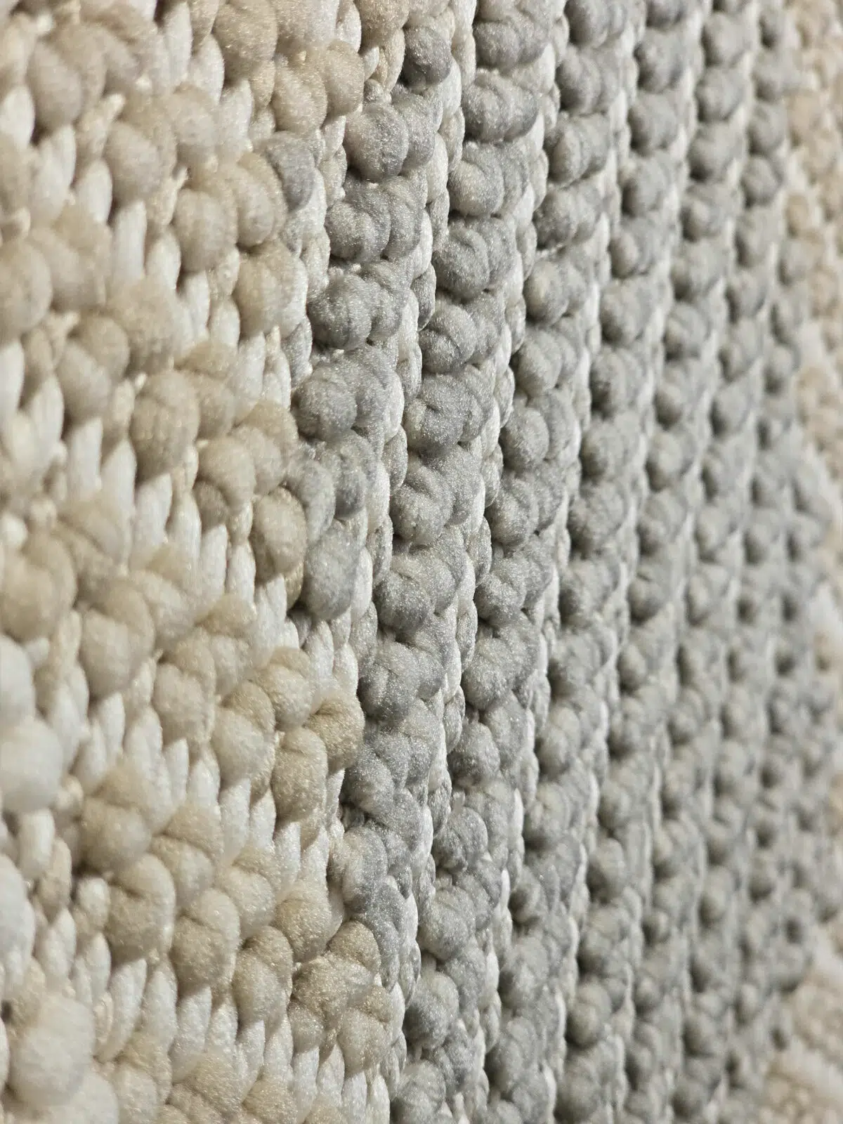 Side-angled close-up of Crater rug with textured pattern