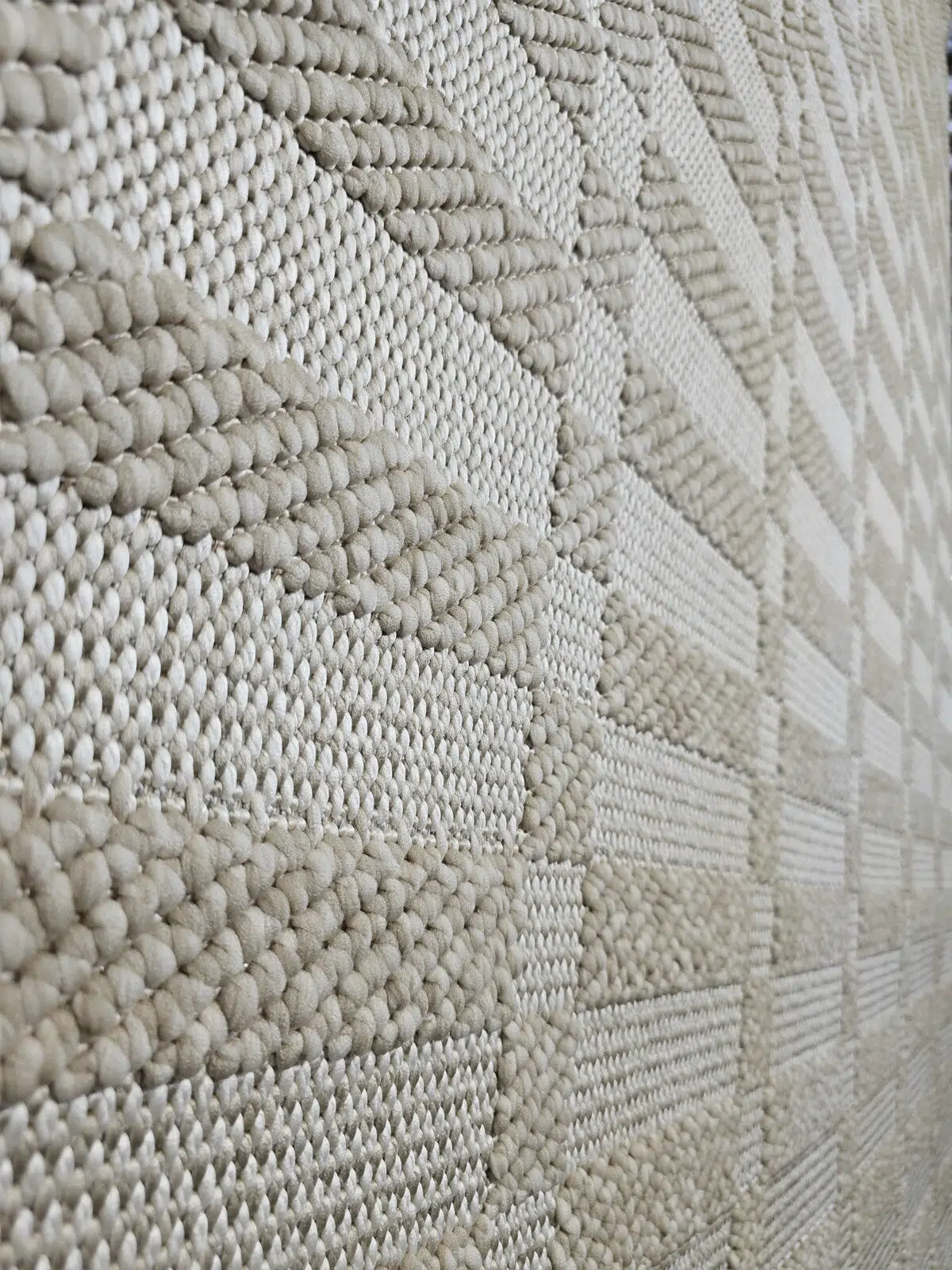 Textured close-up of Umbra rug’s raised patterns.