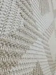 Zoom-in on diamond design and yarn of Comet rug