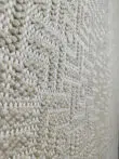 Angled detail showing Oberon rug’s minimalist surface