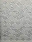 Cream-colored Mars carpet photographed diagonally to show repeating diamond flow
