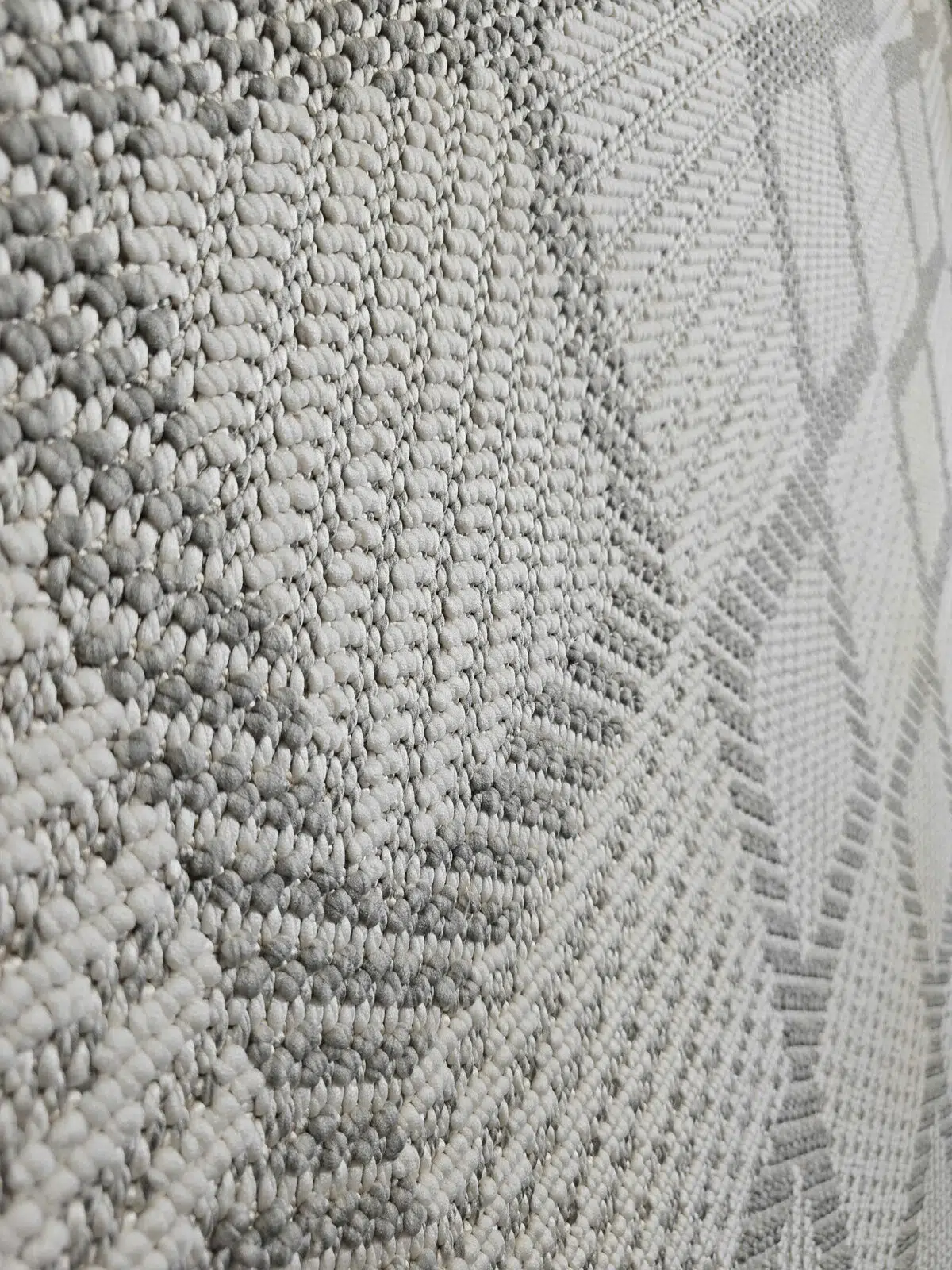 Angled close-up showcasing texture alignment in Zephyr rug design