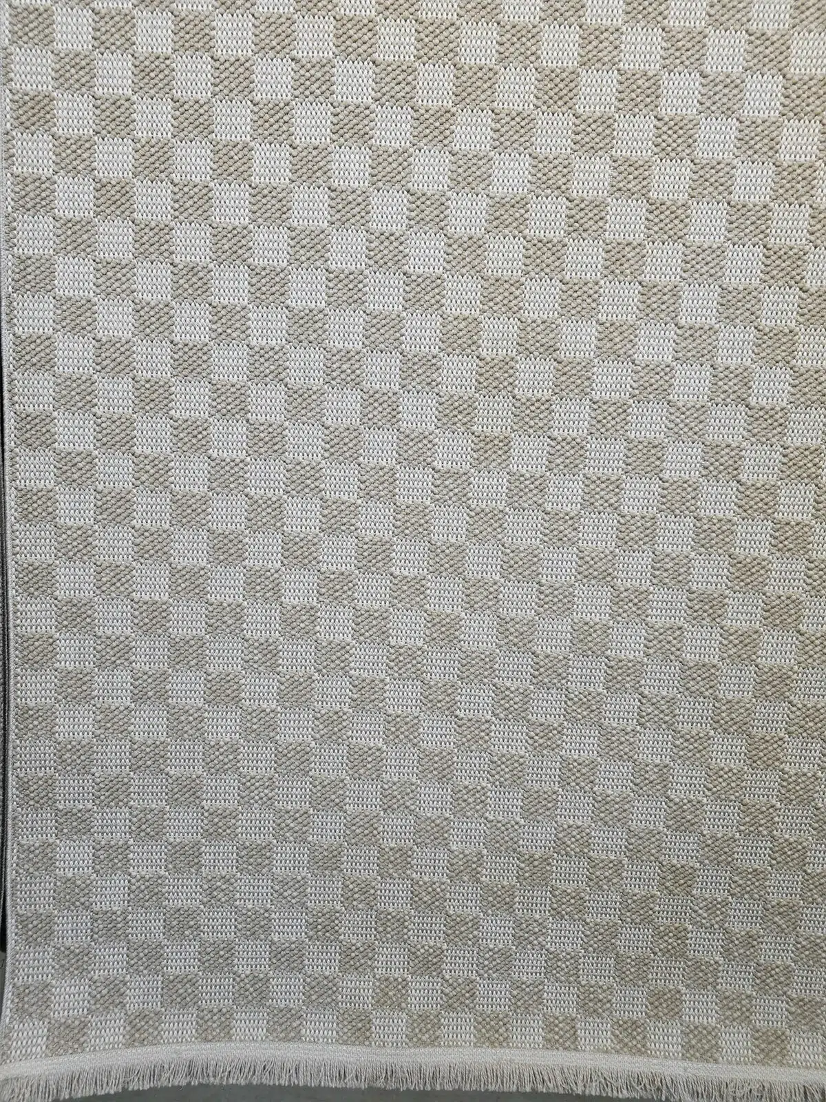 Side angle image showing continuous pattern and high-quality stitch on Helios rug