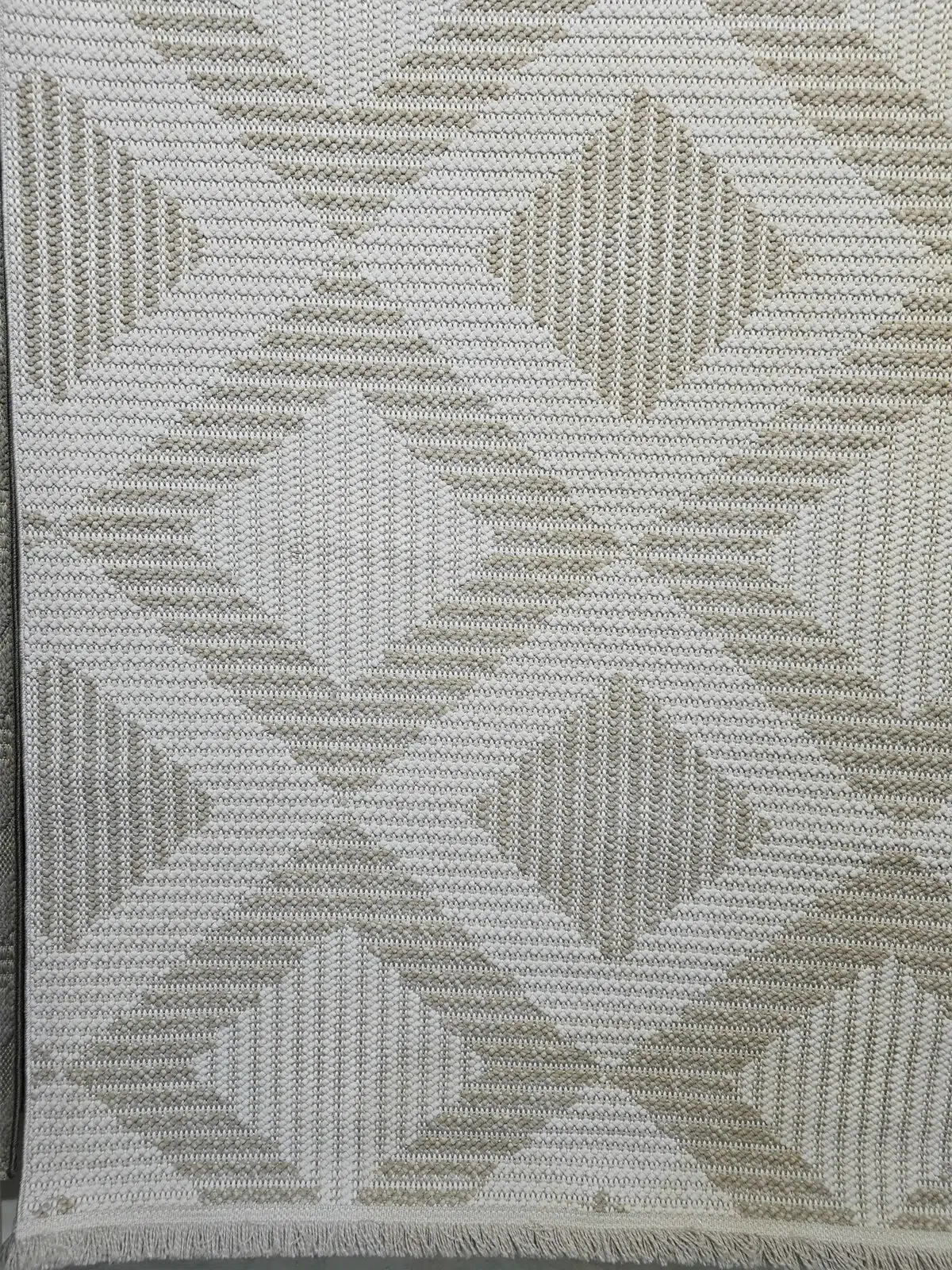 Bottom view of Comet rug on display